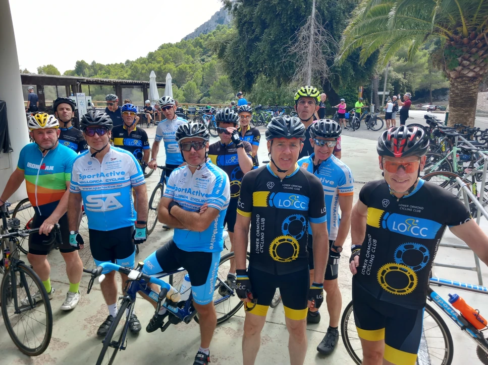 Mallorca cyclists at a coastal lunch stop with SportActive Cycling