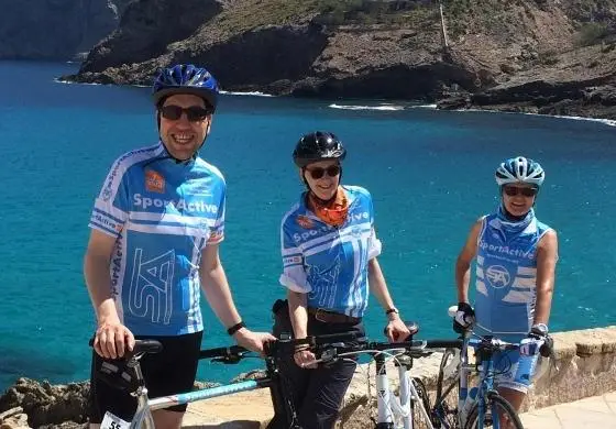 SportActive Cycling Holidays and Training Camps - Mallorca leisure cyclists standing by the sea 